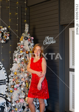 Beautiful happy woman in new year decor. New Year Beautiful happy woman in new year decor. New Year 60067012