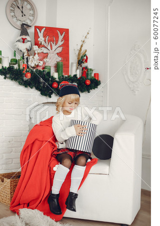 Little girl at home 60077245