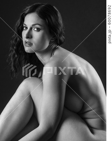 Nude woman sitting and posing 60078692