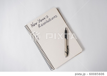 Phrase New Year's resolutions in the notebook and 60085606