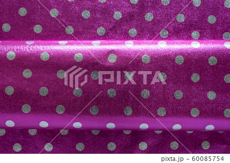 Purple shiny wrapping paper with polka dots with a Purple shiny wrapping paper with polka dots with a 60085754