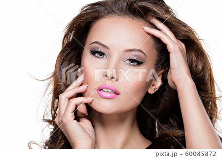 Portrait of a pretty fashion model touching tha 60085872
