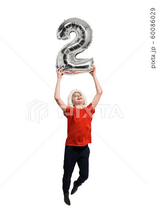 Silver inflatable number 2 in the hands of a Silver inflatable number 2 in the hands of a 60086029