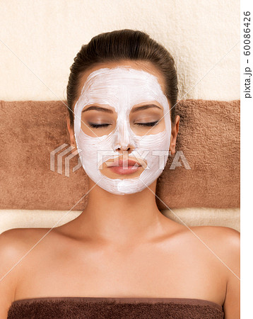 Young woman with mask on her face relaxing in the Young woman with mask on her face relaxing in the 60086426