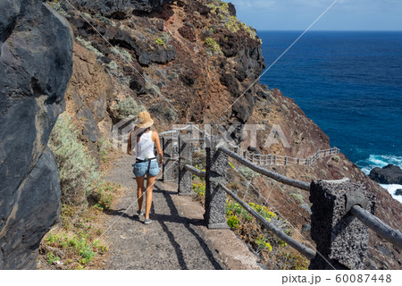young active woman walks on the path 60087448
