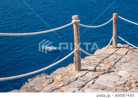 fishing boat viewed from above in a beautiful blue sea fishing boat viewed from above in a beautiful blue sea 60087495