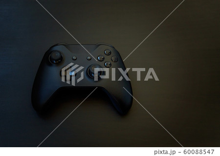 Black joystick isolated on black background 60088547