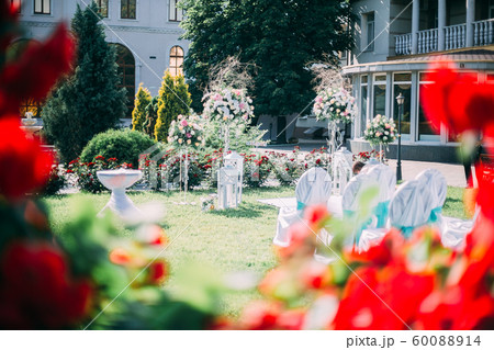 Beautiful wedding day ceremony set up. Outdoor. 60088914