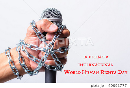 Hand holding microphone and have chain on fist 60091777