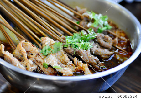 grilled pork in spicy soup, Chinese style grilled pork in spicy soup, Chinese style 60095524