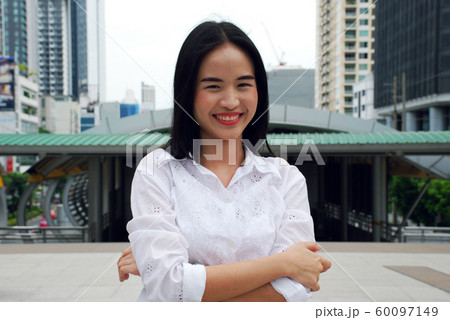 Beautiful business woman smile portrait and relaxation on walking street at outdoor. Beautiful business woman smile portrait and relaxation on walking street at outdoor. 60097149