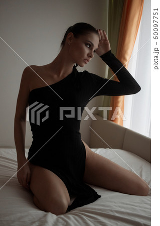 Brunette girl in a cat mask Brunette girl in a cat mask 60097751