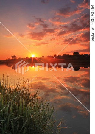 Beautiful sunset over the river in the spring countryside 60098564