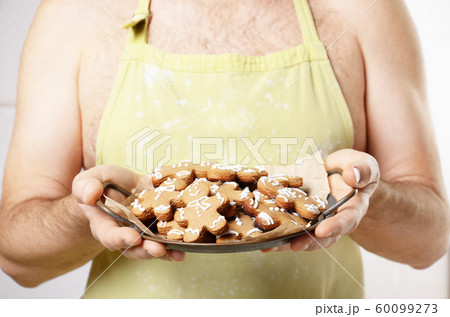 Middle aged caucasian male model in green apron Middle aged caucasian male model in green apron 60099273