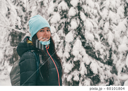 Image of tourist woman walking in winter forest. Image of tourist woman walking in winter forest. 60101804