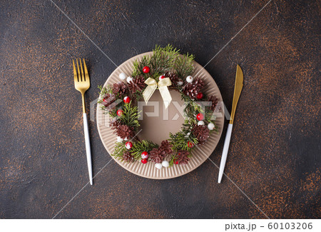 Christmas table setting and golden decor Christmas table setting and golden decor 60103206