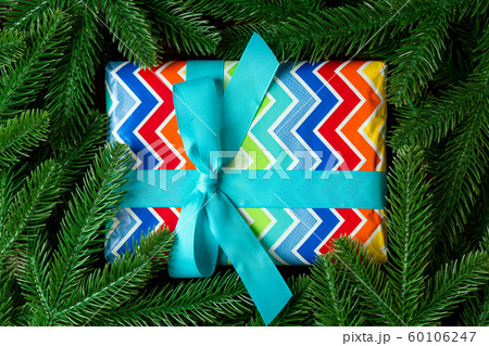 Top view of New Year gift box decorated with fir 60106247