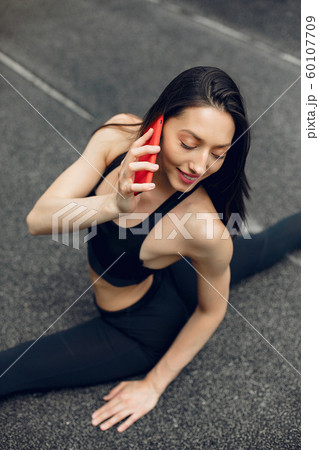 Sports girl training at the stadium Sports girl training at the stadium 60107709