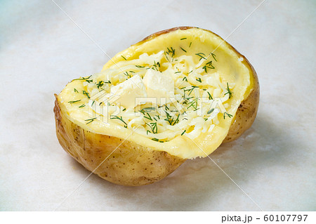 Image of fresh baked potato with butter on white background 60107797