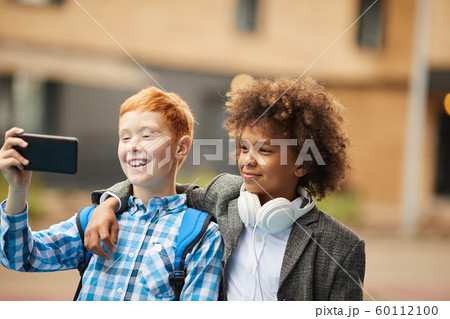 Selfie portrait of two friends 60112100