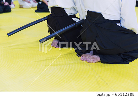 People in kimono on martial arts weapon training seminar 60112389