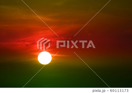 sunset on green red orange sky back soft evening 60113173