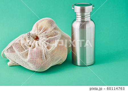 Aluminum bottle and fruits in a natural bag Aluminum bottle and fruits in a natural bag 60114763