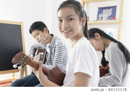 Young Asian girl teenager happy with playing Young Asian girl teenager happy with playing 60115178