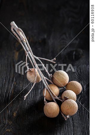 group longan fruits on a dark background 60116938