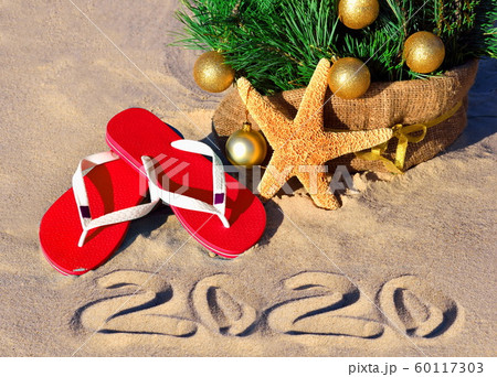 New Year 2020 on the beach. Christmas tree with New Year 2020 on the beach. Christmas tree with 60117303