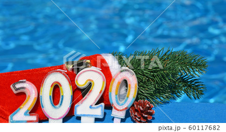Christmas decorations and pine branch 2020. 60117682