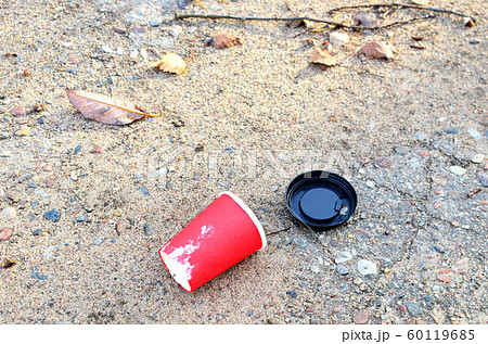People throw coffee cups to the street. People throw coffee cups to the street. 60119685