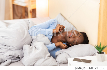 Smiling Black Girl Waking Up Lying In Bed At Home 60121965