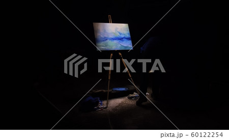 Artist copyist paint seascape with ship in ocean. Craftsman decorator draw as boat sail on blue sea. Black background. Wide angle shot. 60122254