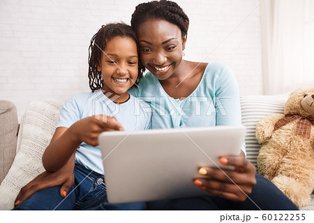 Afro mom and daughter making video call Afro mom and daughter making video call 60122255