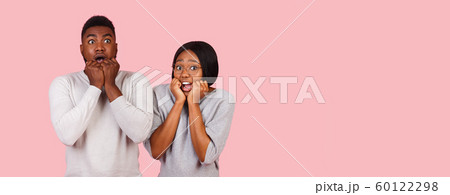 Stunned afro couple amazed by shocking news Stunned afro couple amazed by shocking news 60122298
