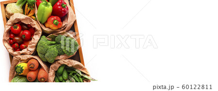 Assortment of organic garden vegetables in wooden box Assortment of organic garden vegetables in wooden box 60122811