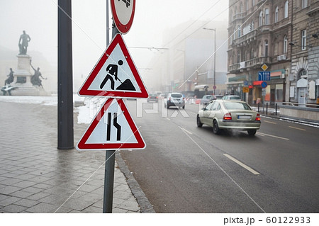 Foggy city street with cars Foggy city street with cars 60122933