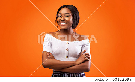 African American Girl Crossing Hands Smiling Standing In Studio, Panorama African American Girl Crossing Hands Smiling Standing In Studio, Panorama 60122995
