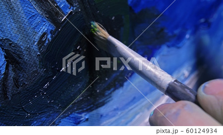 Artist copyist paint seascape with ship in ocean. Craftsman decorator draw as boat sail on blue sea with acrylic oil color. Draw finger brush palette. 60124934