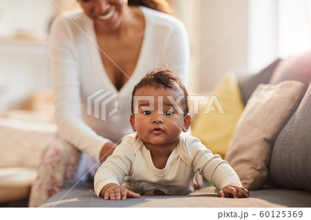 Mother Caring for Cute Baby 60125369