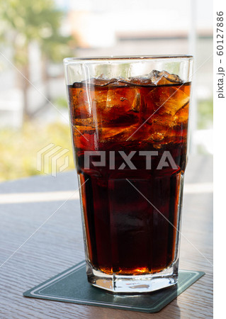 glass of soft drink with summer view glass of soft drink with summer view 60127886