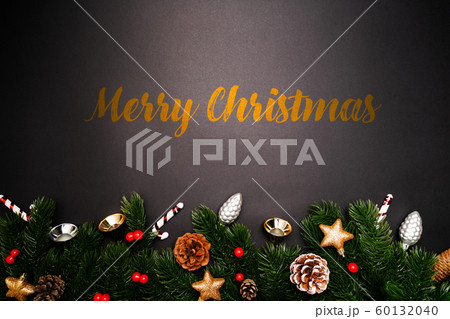 Christmas pine tree with xmas decoration on black background 60132040