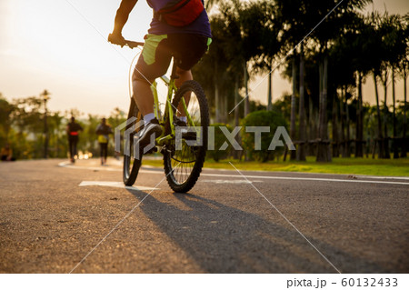 Man ride on bike on the road. Man ride on bike on the road. 60132433