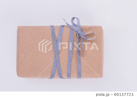 Gift box wrapped in craft paper. Gift box wrapped in craft paper. 60137723