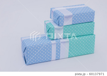 Row of gift boxes on light background. Row of gift boxes on light background. 60137971
