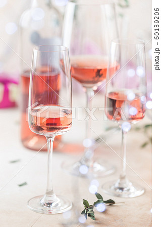 Glasses and bottle of rose wine 60139206
