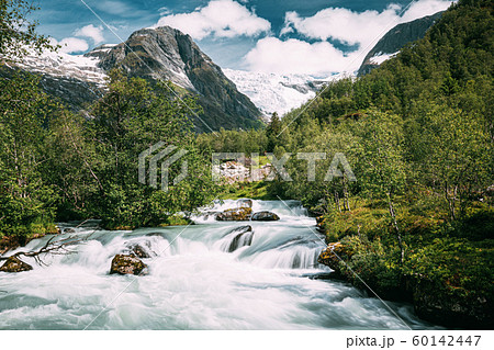Jostedalsbreen National Park, Sogn Og Fjordane County, Norway. River Near Boyabreen Glacier Landscape In Spring Sunny Day. Famous Norwegian Landmark And Popular Destination 60142447