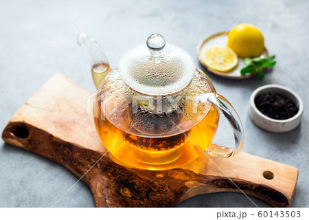 Tea in glass tea pot Tea in glass tea pot 60143503