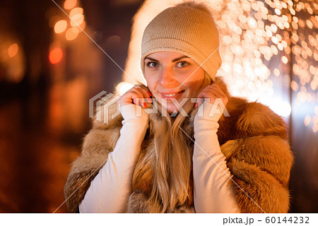 Outdoor close up portrait of young happy smiling girl posing on street. Outdoor close up portrait of young happy smiling girl posing on street. 60144232